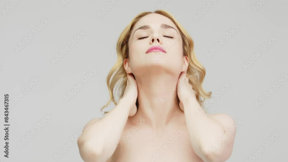 Portrait of a charming, sensual blonde on a light background. Cosmetology concept. Close up portrait of a charming half-naked woman in the studio. Portrait of a charming, sensual blonde on a light background. Cosmetology concept. Close up portrait of a charming half-naked woman in the studio.