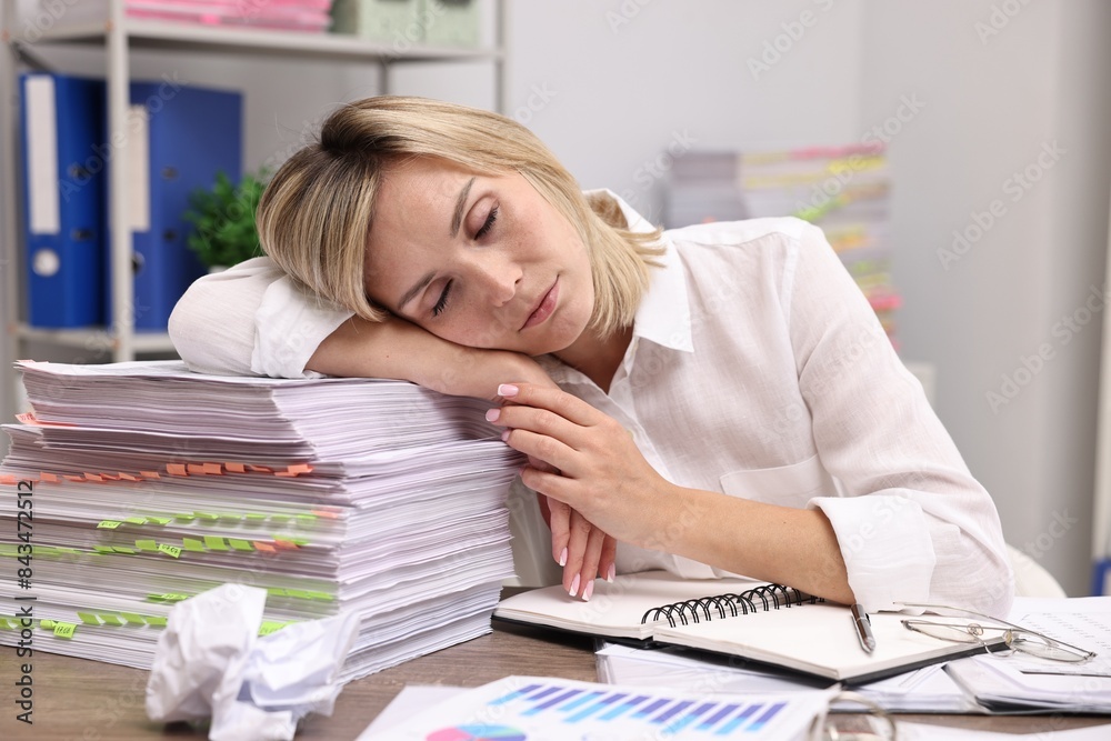 Office worker sleeping at workplace. Overwhelmed by work Office worker sleeping at workplace. Overwhelmed by work