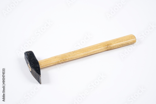 Carpenter hammer with wooden handle on an isolated white background.