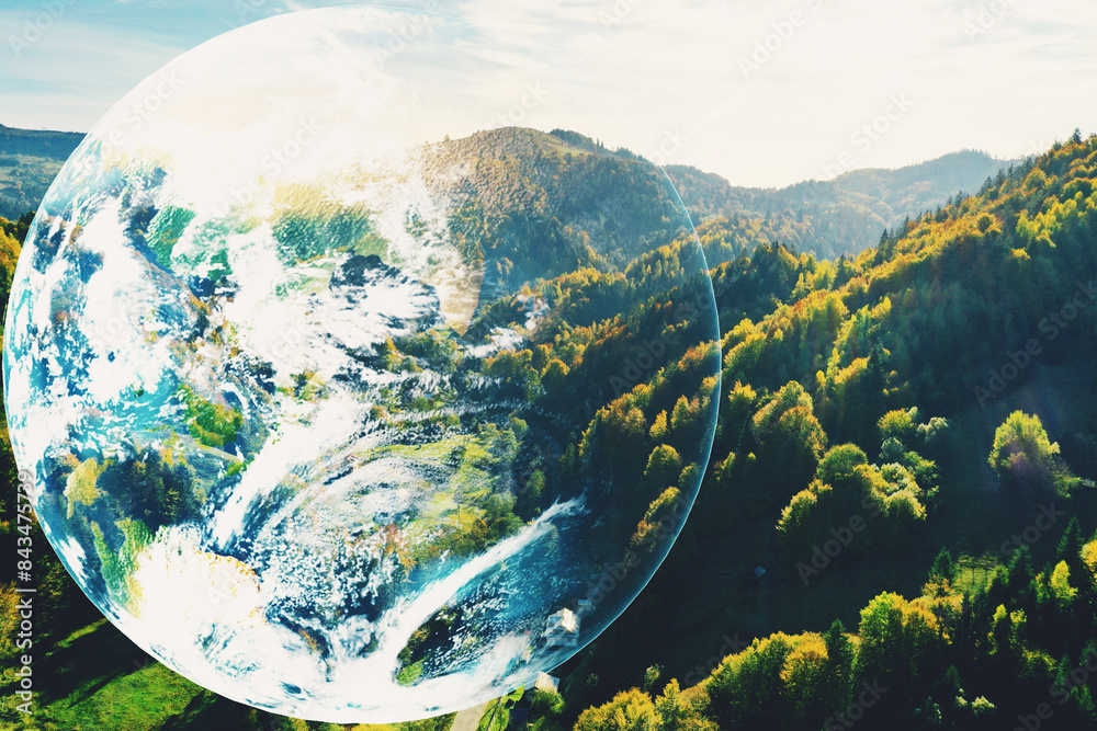 Fototapeta premium Save the planet. Beautiful mountains and planet Earth, double exposure
