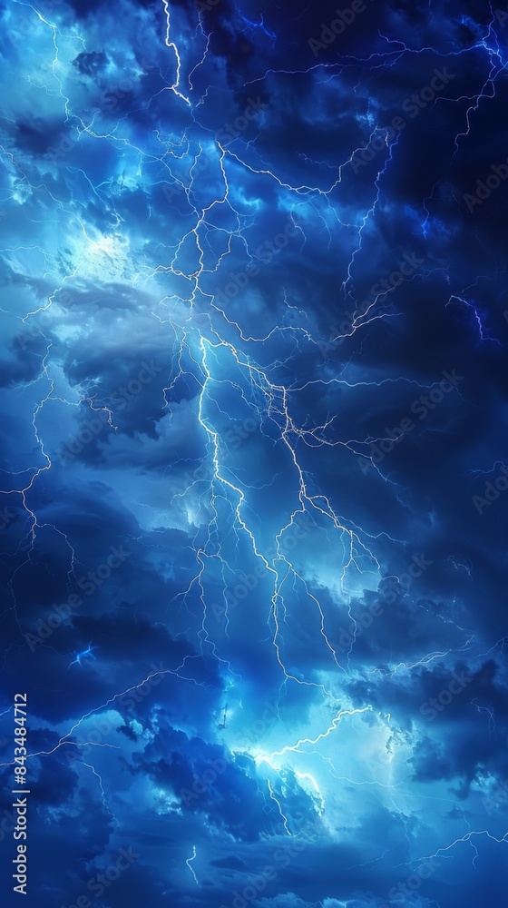 Dramatic blue sky with branching lightning bolts illuminating the clouds during a severe thunderstorm. Dramatic blue sky with branching lightning bolts illuminating the clouds during a severe thunderstorm.