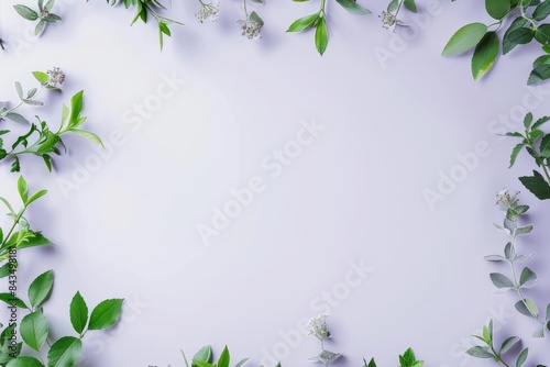 Flat lay top view of blank stationery items arranged in a symmetrical pattern on a calming lavender background, with subtle green leaves adding a touch of nature. The minimalist aesthetic and mockup