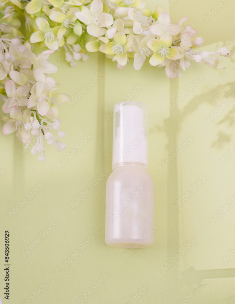 Unlabeled bottle of cosmetic or soap shower gel is displayed on an artistic background, product enclosure for liquid product for promotional Unlabeled bottle of cosmetic or soap shower gel is displayed on an artistic background, product enclosure for liquid product for promotional