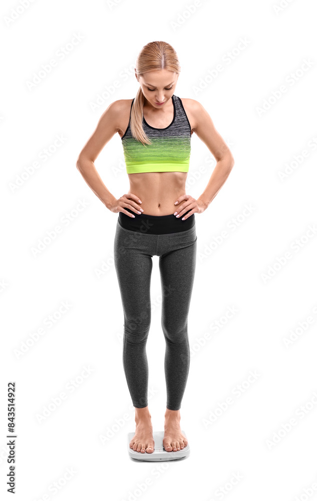 Woman standing on floor scale against white background Woman standing on floor scale against white background
