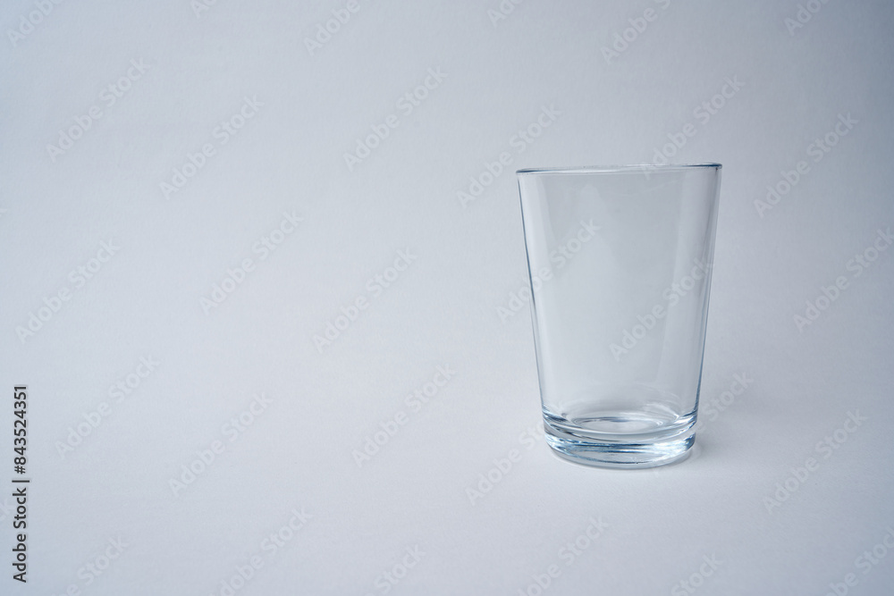 Small water glass on a white background. Small water glass on a white background.