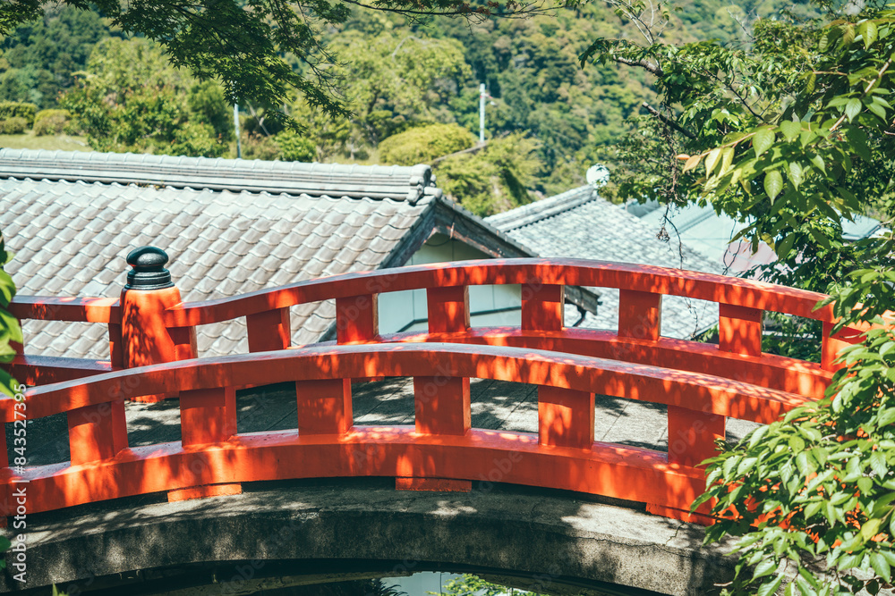 Scenic landscape with a red wooden bridge on the way to Kumano-Nachi Taisha, in Japan. Scenic landscape with a red wooden bridge on the way to Kumano-Nachi Taisha, in Japan.