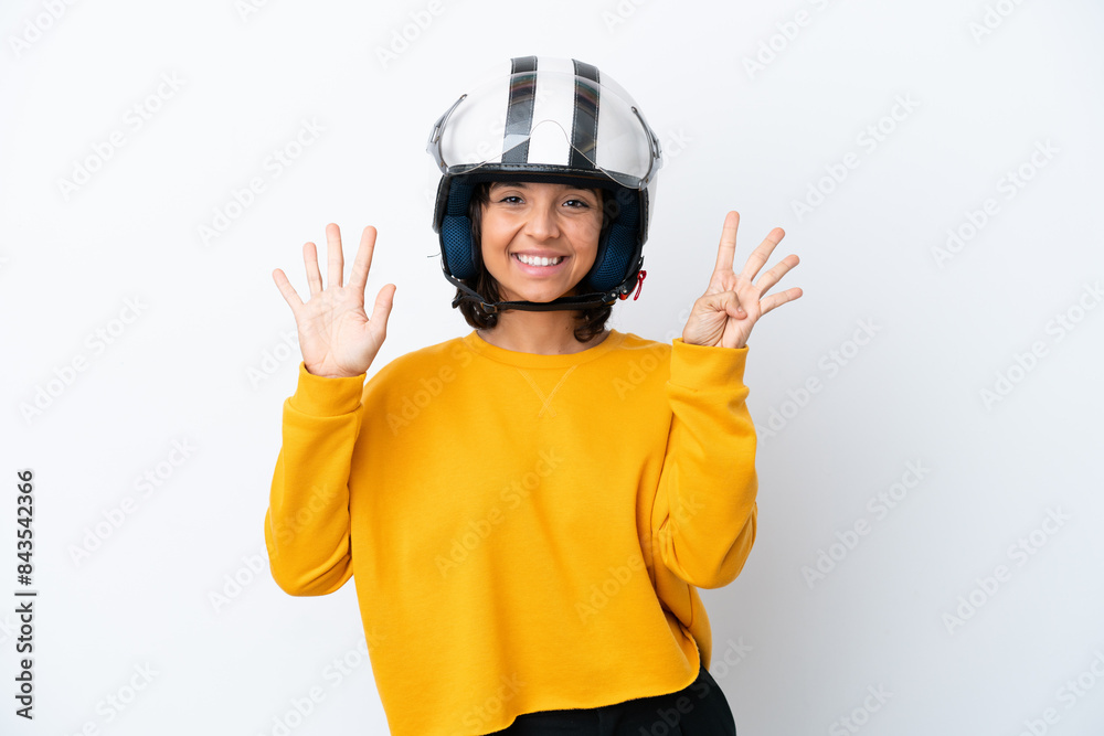 Woman with a motorcycle helmet counting nine with fingers
