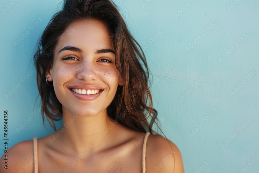 A close up portrait of a young woman with a subtle smile A close up portrait of a young woman with a subtle smile