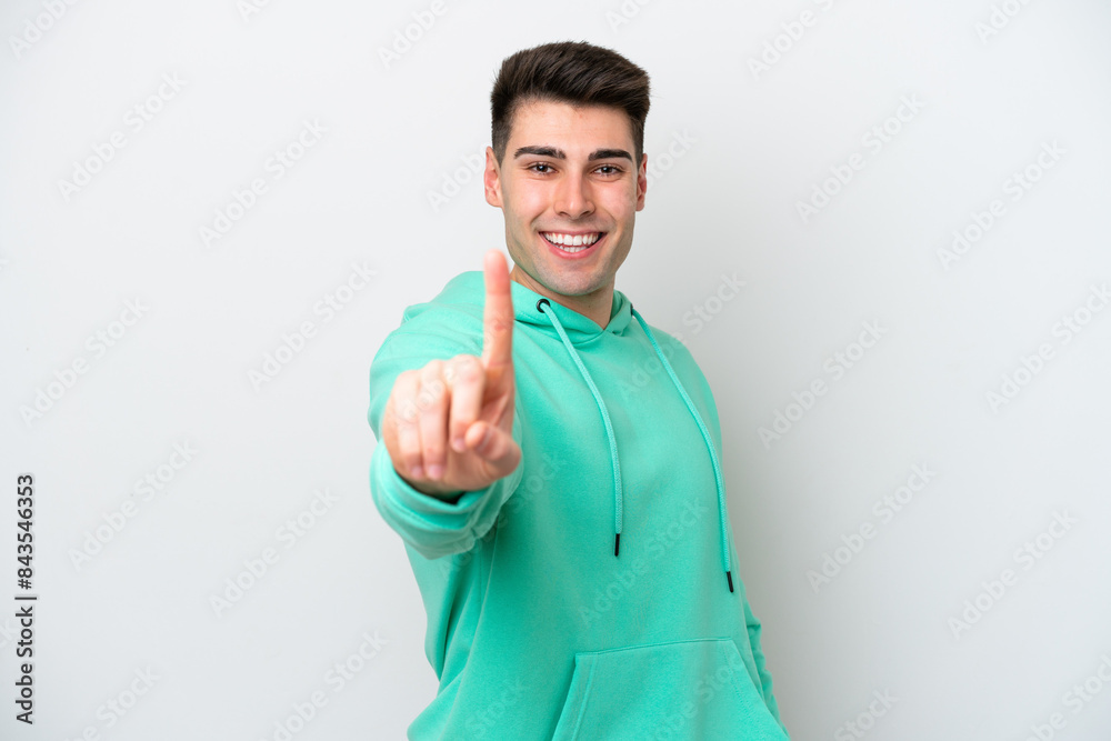 Young caucasian man isolated on white background showing and lifting a finger Young caucasian man isolated on white background showing and lifting a finger