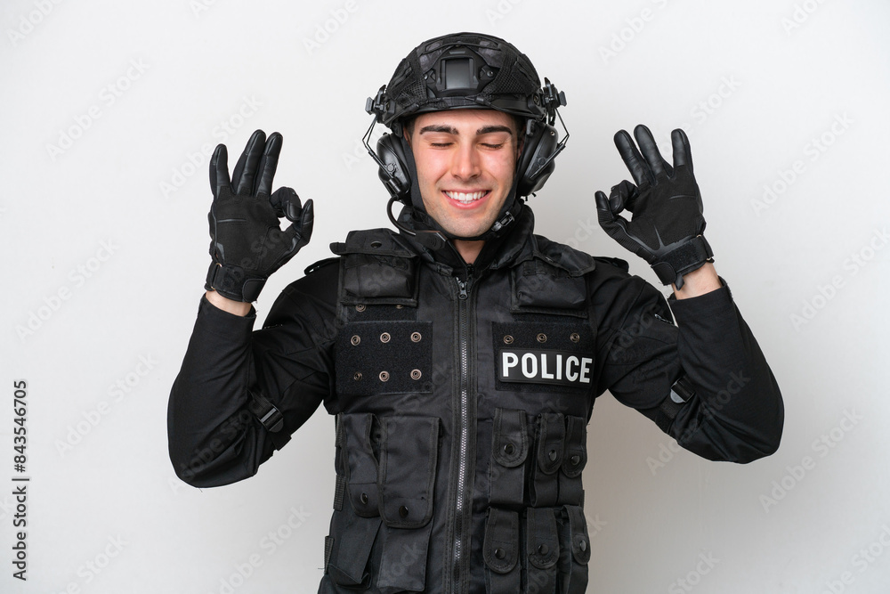 SWAT caucasian man isolated on white background in zen pose SWAT caucasian man isolated on white background in zen pose