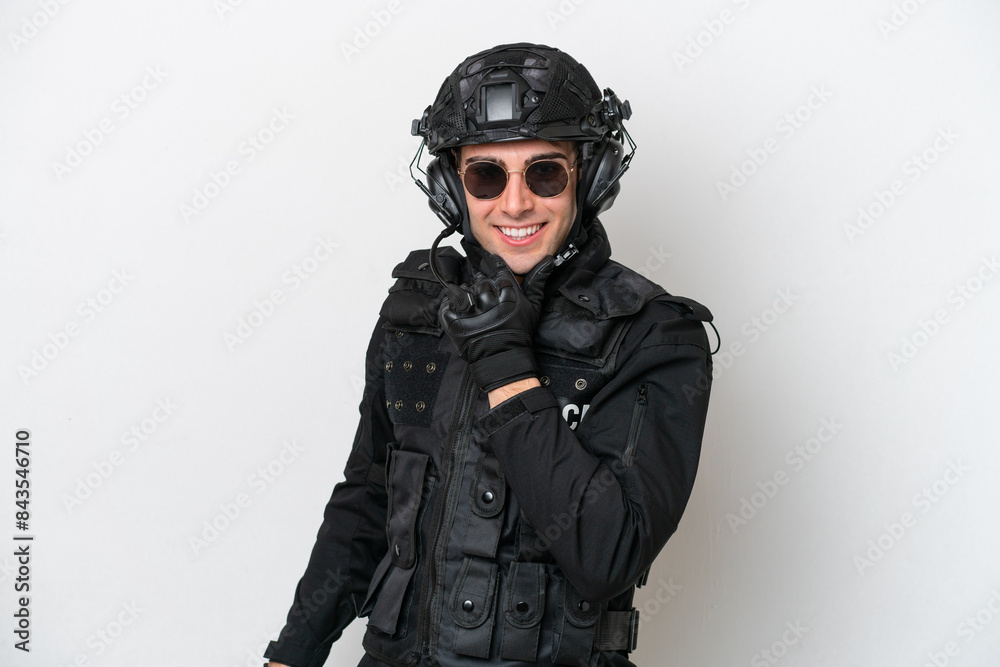 SWAT caucasian man isolated on white background with glasses and smiling SWAT caucasian man isolated on white background with glasses and smiling