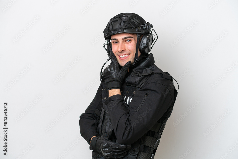 SWAT caucasian man isolated on white background smiling SWAT caucasian man isolated on white background smiling