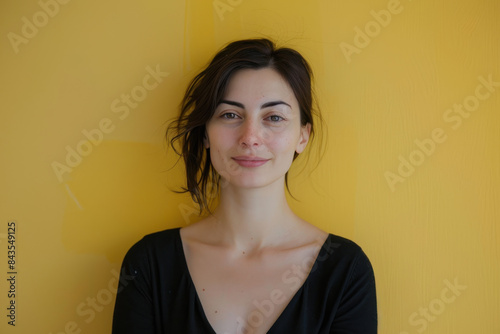 A close up portrait of a young woman with a subtle smile © MagnusCort