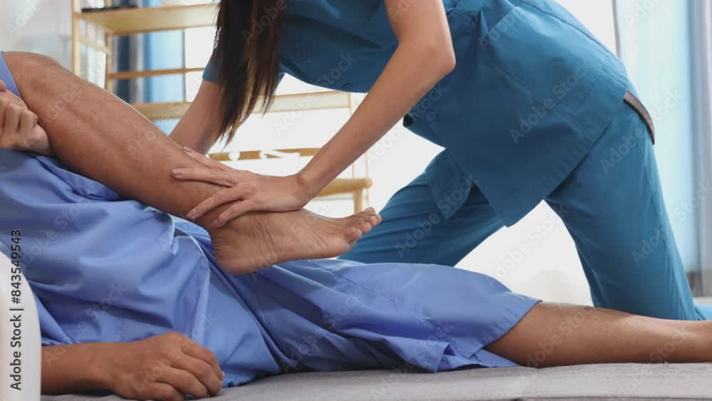 Woman on physiotherapy table lying on the side. Professional physician is massaging back of women , manual therapy and osteopathy