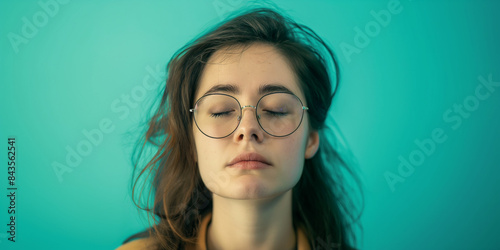 A woman with glasses on her face
