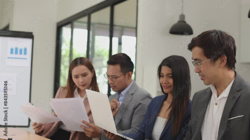 Team of Asian business people and working together in office, Startup projects and business presentation. Team of Asian business people and working together in office, Startup projects and business presentation.