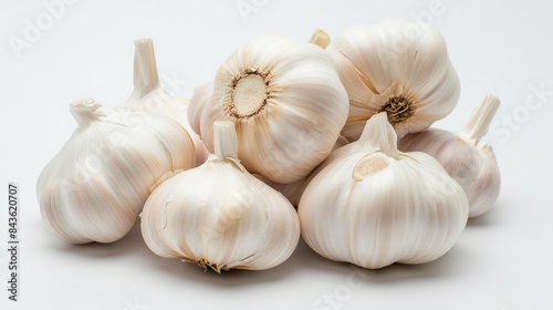 A Group of Fresh Garlic Bulbs on a White Background