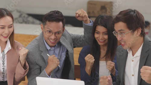 Excited Asian business team celebrating success in office, About successful startup projects concept.