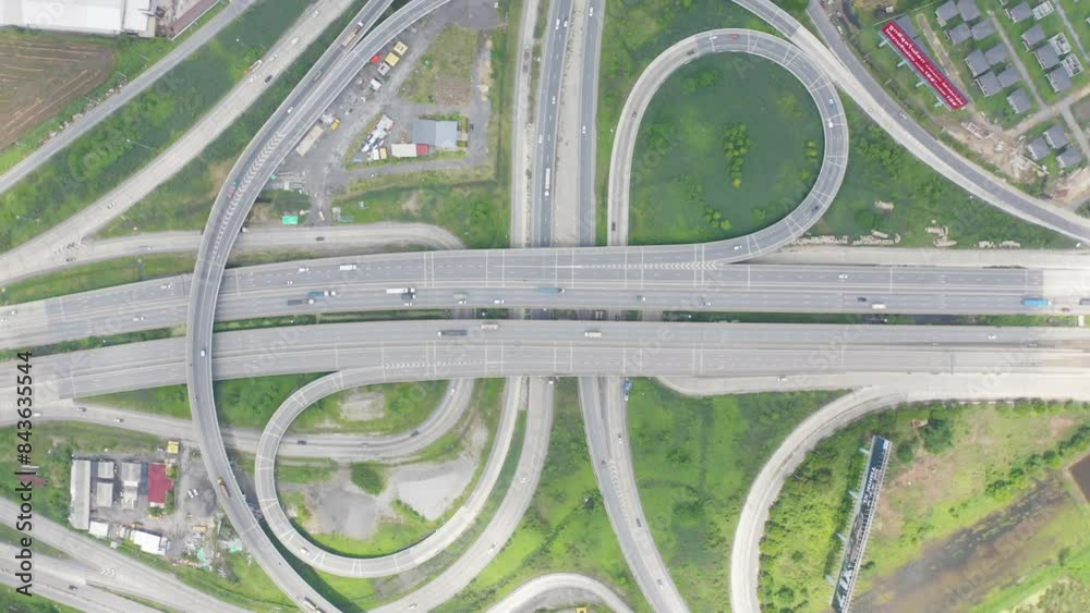 Aerial view of cars driving on highway or moterway. Overpass bridge street roads in connection network of architecture concept. Top view. Urban city, Bangkok, Thailand. Aerial view of cars driving on highway or moterway. Overpass bridge street roads in connection network of architecture concept. Top view. Urban city, Bangkok, Thailand.