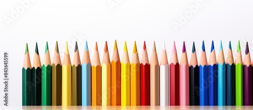 Copy space image of a colored pencil sitting motionless on a plain white background