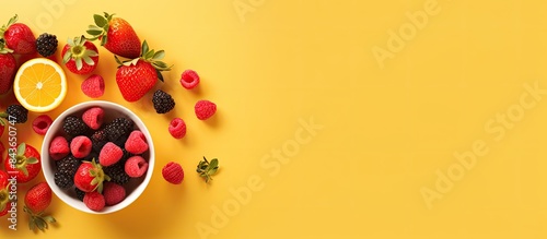 A copy space image featuring a delicious breakfast spread can be seen from a bird s eye perspective showcasing fresh strawberries on a vibrant yellow backdrop