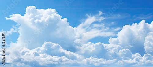 The alternating blue sky and white clouds can serve as the background image. copy space available