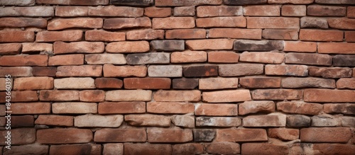 Background with stone wall of red bricks in closeup texture and copy space