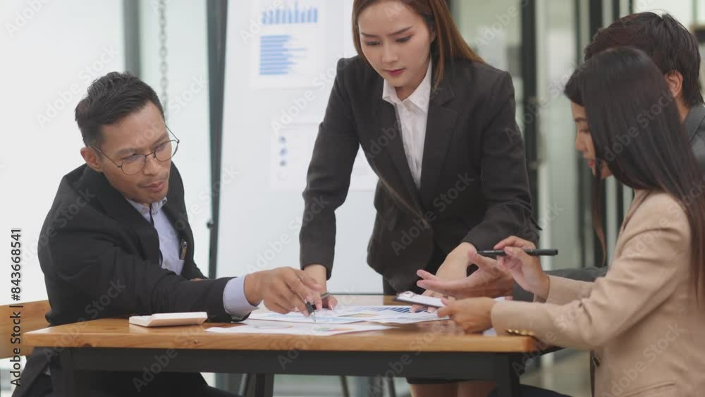 Team of Asian business people and working together in office, Startup projects and business presentation. Team of Asian business people and working together in office, Startup projects and business presentation.