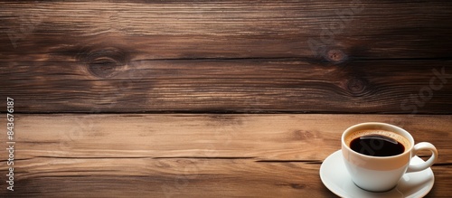 A copy space image of a cup of coffee placed on a rustic wooden background