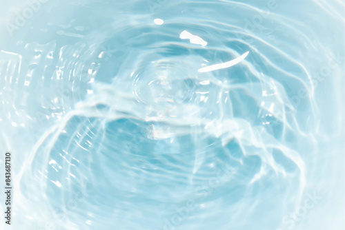 Blue water with ripples on the surface. Defocus blurred transparent blue colored clear calm water surface texture with splashes and bubbles. Water waves with shining pattern texture background.