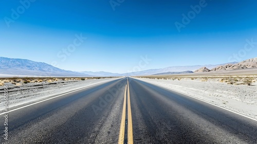 State Route 190 crossing Panamint Valley in Death Valley National Park California United States Empty desert road in Death Valley with clear blue sky : Generative AI photo