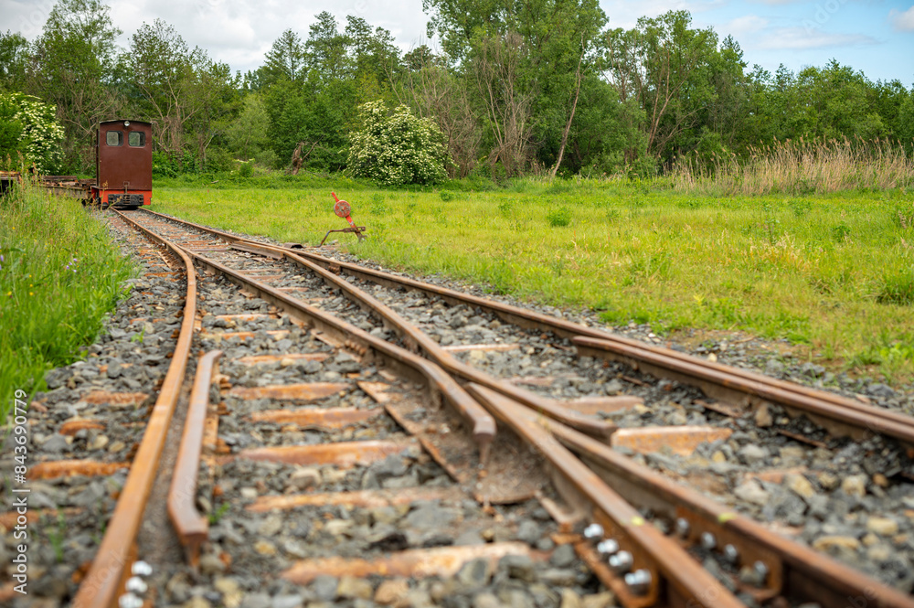 railway junction, and the back of a small locomotive railway junction, and the back of a small locomotive