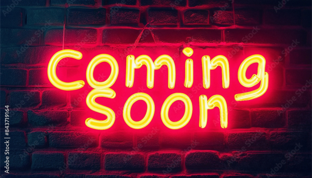 A vibrant neon sign with the words Coming Soon is illuminated on a textured brick wall under warm light A vibrant neon sign with the words Coming Soon is illuminated on a textured brick wall under warm light