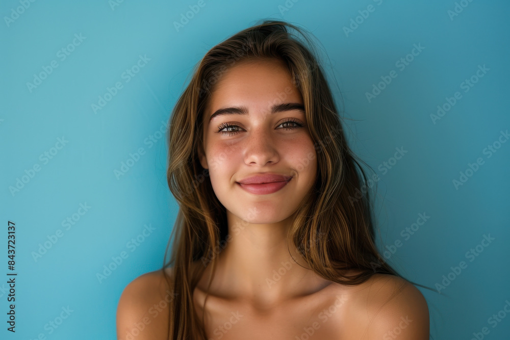 A close up portrait of a young woman with a subtle smile A close up portrait of a young woman with a subtle smile