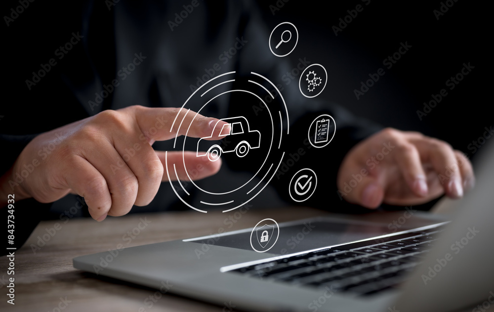 A businessman interacts with a virtual car service interface on a touchscreen, representing automotive services and management. A businessman interacts with a virtual car service interface on a touchscreen, representing automotive services and management.