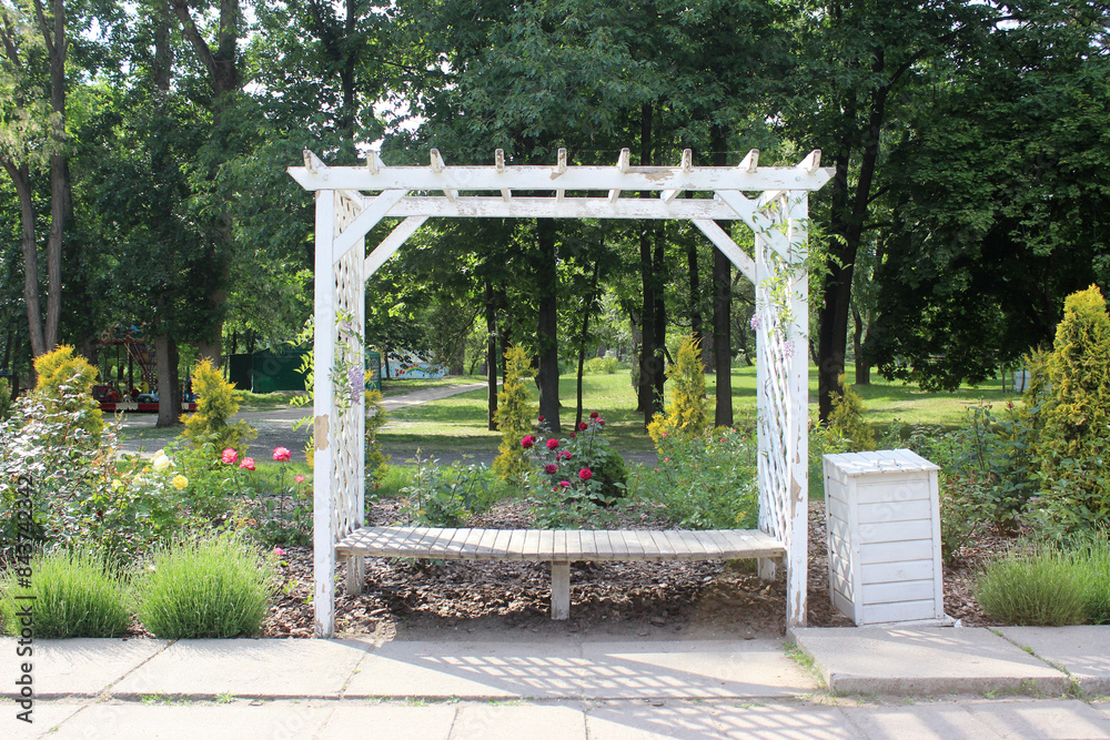 white bench gazebo in the park white bench gazebo in the park