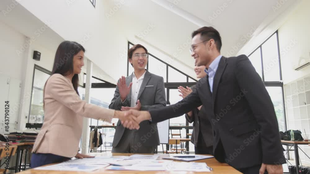 Team of Asian business people shaking hands meeting in office, Startup projects, Business partners handshaking after successful negotiations or signing contract. Team of Asian business people shaking hands meeting in office, Startup projects, Business partners handshaking after successful negotiations or signing contract.