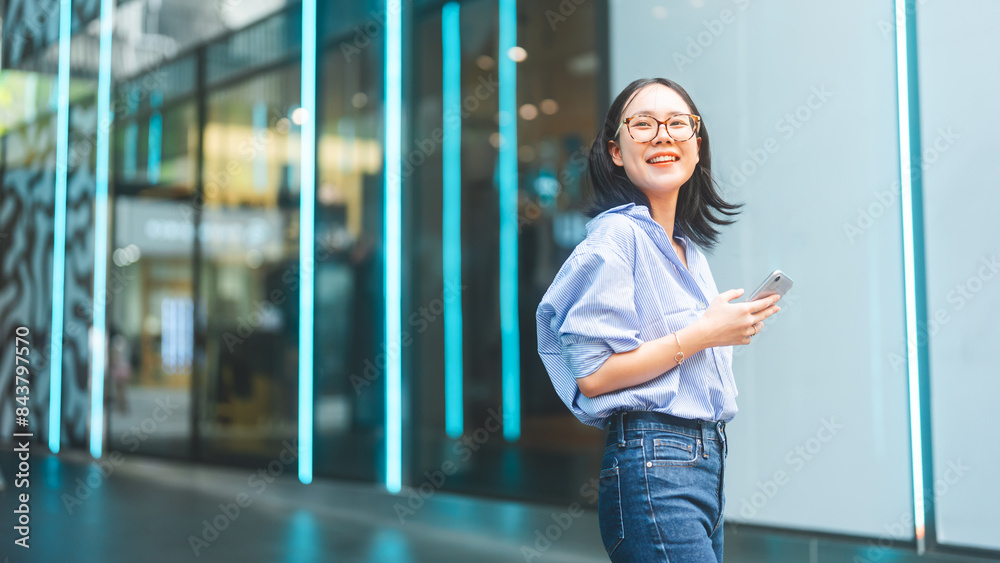 Business asian woman using smartphone city lifestyles with casual fashion positive look Business asian woman using smartphone city lifestyles with casual fashion positive look