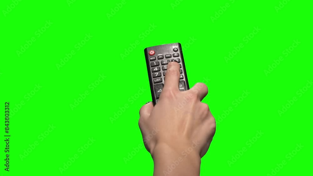 Female hand changes the channel with the remote control. Green Screen 4k