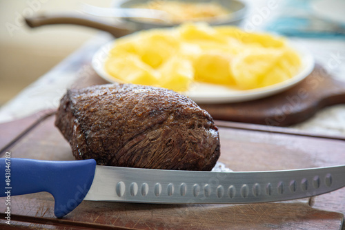 Grassfeed beef known as picanha, roasted and rare, the best meat in the world for barbecue photo