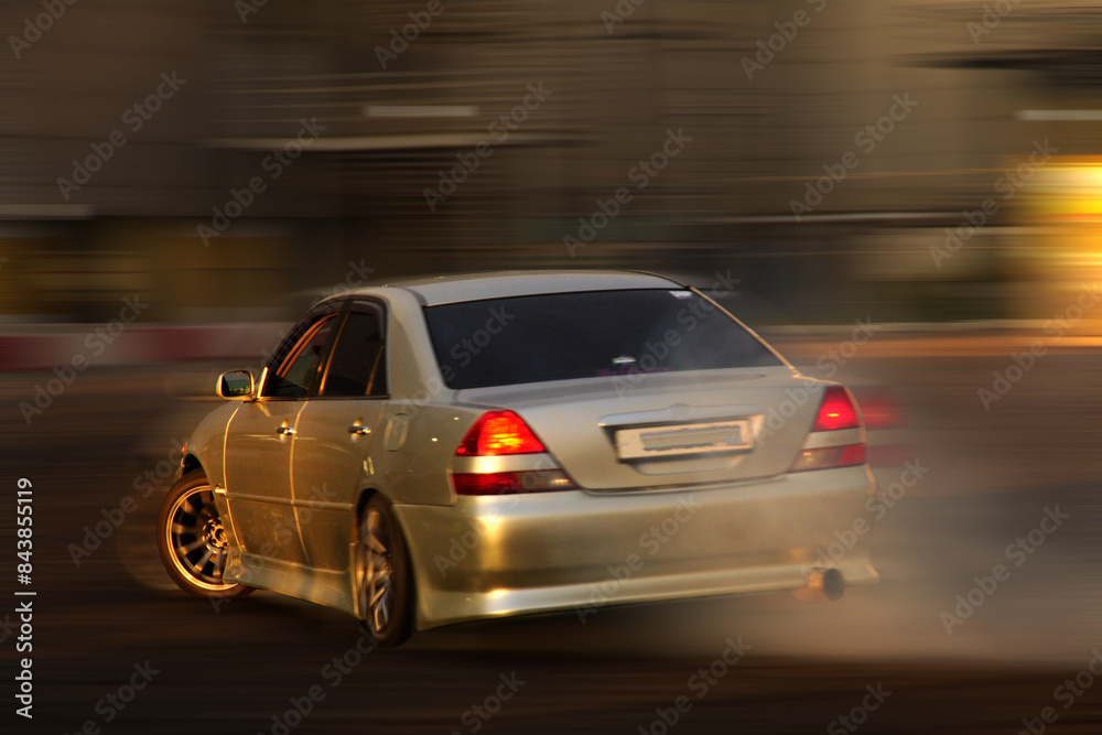 Car speeding by with blur in background. Blur motion. Car speeding by with blur in background. Blur motion.