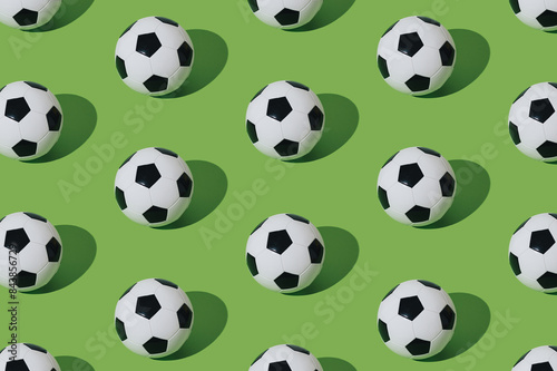 Trendy football pattern composition on light green background. Minimal sport concept. Creative football or soccer pattern idea. Football aesthetic background.