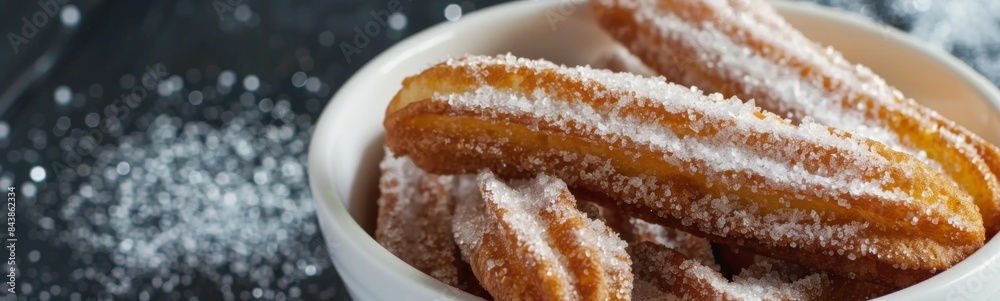 Sugared doughnuts in a bowl on a table, sugar dessert, food background Sugared doughnuts in a bowl on a table, sugar dessert, food background