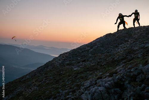 Preparations for flight from the summit with wingsuit