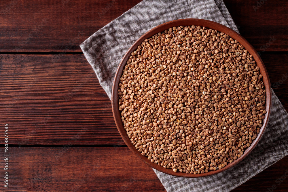 Wholegrain Buckwheat on Rustic Kitchen Table with Linen Napkin, Copy Space