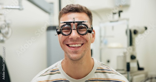Portrait, happy man and trial frame for eye care, vision and healthcare in clinic. Face, smile and patient with test lens or tool for wellness, ophthalmology or optometry for eyesight correction exam photo