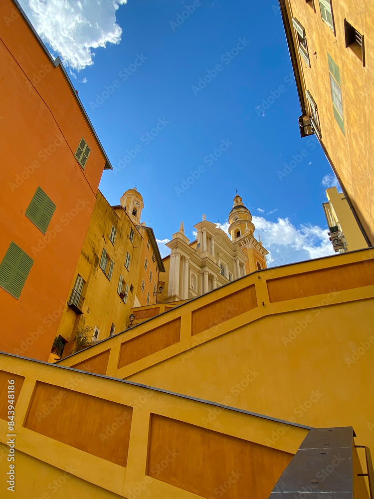 The Basilica of Saint-Michael the Archangel in Menton, France. The tall bell tower on the right side of the church was added at the beginning of the 18th century.
