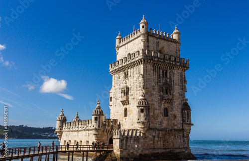 Obraz na płótnie Lisbon, Portugal, April 24, 2022: The Belem Tower (Torre de Belém) was built between 1514 and 1520 in a Manueline style by the Portuguese architect and sculptor Francisco de Arruda. w salonie