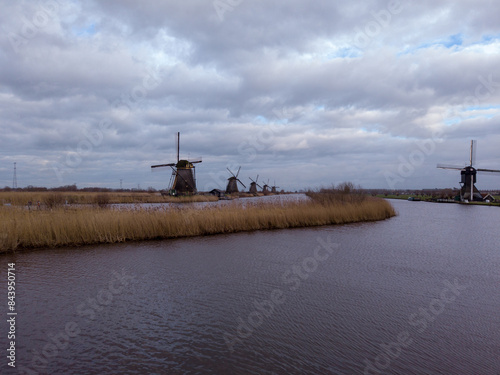 Obraz na płótnie The windmills of Kinderdijk, in the province of South Holland, Netherlands. Nineteen beautiful windmills, built around 1740, stand here as part of a larger water management system to prevent floods. w salonie