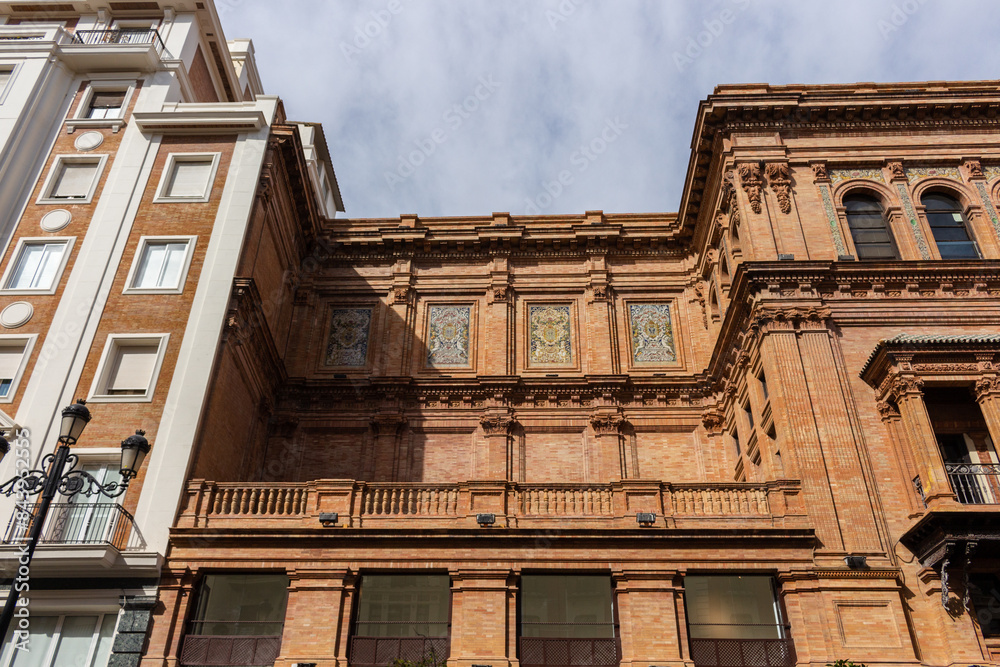 Seville, Spain, September 12, 2021: The Coliseum building, Edificio Coliseo, a former theater and now office building located on Constitution Avenue.